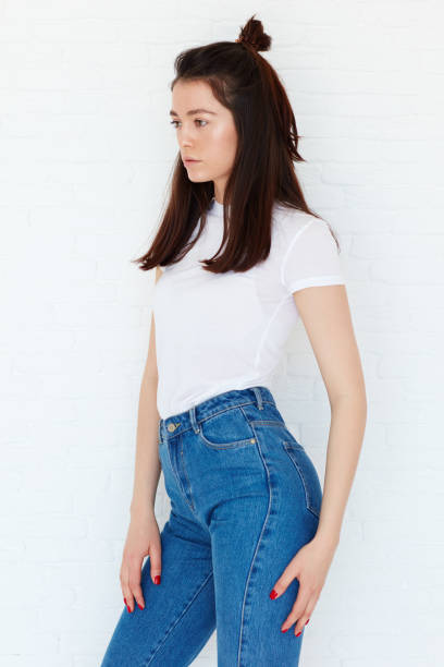 istock young attractive girl posing on model test shoot with natural day light 864998224