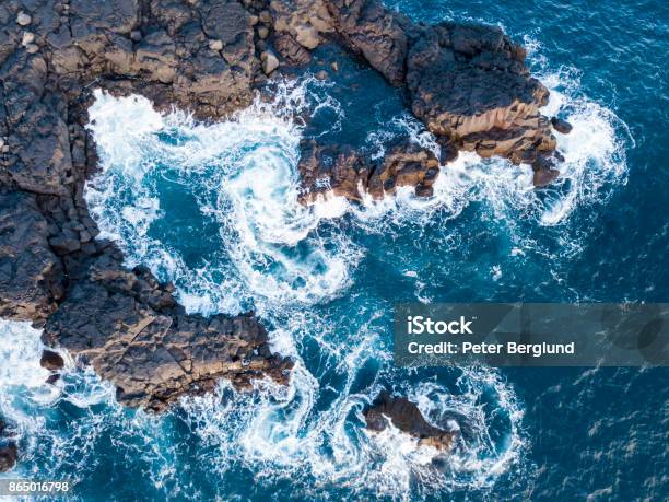 Waves Splashing Against Volcanic Rocks Stock Photo - Download Image Now - Rock - Object, Sea, Rough