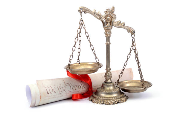 istock Scales of justice and US Constitution. 865023130