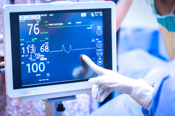 istock Female surgeon using monitor in operating room. 865029694