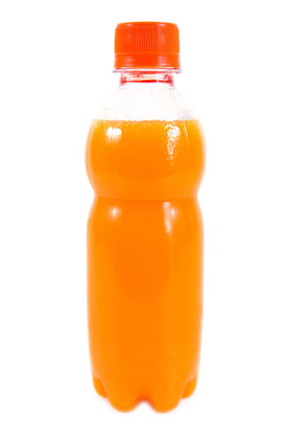 istock Orange juice in plastic bottle isolated on white background 865029990