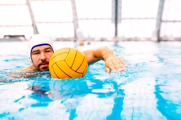 istock Water polo player in a swimming pool. 865035844