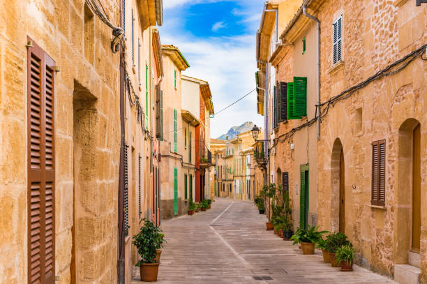 Majorca Spain, idyllic street at the old town of Alcudia Street at the old town of Alcudia, Spain Balearic islands. bay of alcudia stock pictures, royalty-free photos & images
