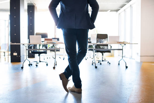 istock Businessman in his office with smartphone and briefcase. 865043164