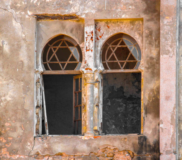 istock Star of David on an old building's window 865046040