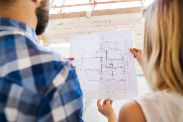 istock Unrecognizable young couple at the construction site. 865046532