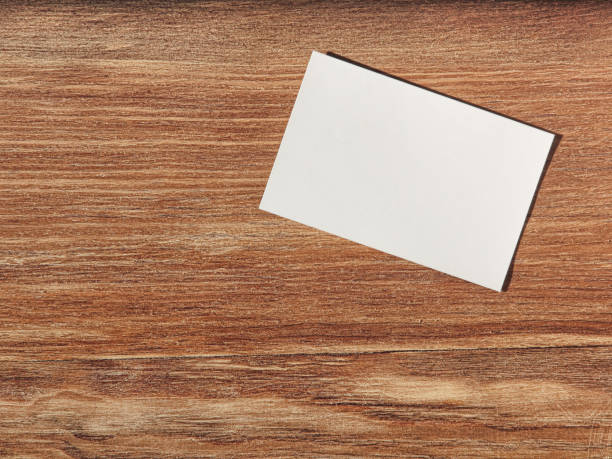 istock White paper blank on wooden wall with empty space. 865052466
