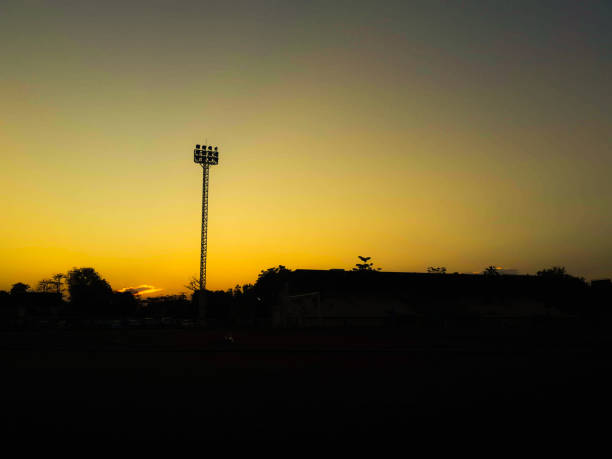 istock Silhouette teen age run together  track. 865055202