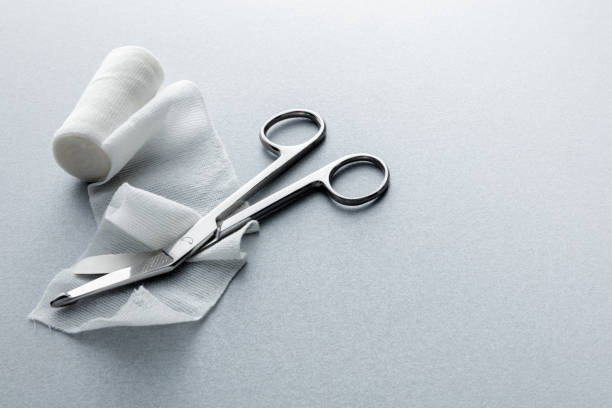 Medical: Bandage and Scissors Still Life Medical: Bandage and Scissors Still Life bandage stock pictures, royalty-free photos & images