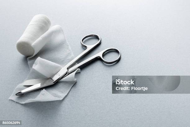 Medical Bandage And Scissors Still Life Stock Photo - Download Image Now - Wound, Bandage, Gauze
