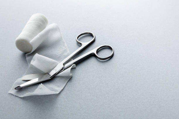 medical: bandage and scissors still life - bandage imagens e fotografias de stock