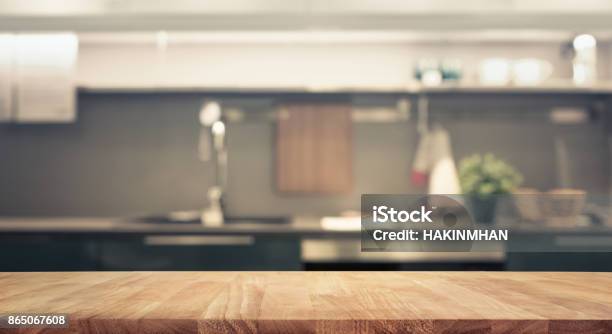 Wood Table Top On Blur Kitchen Wall Room Background Stock Photo - Download Image Now