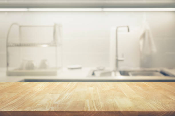 istock Wood table top on blur kitchen wall room background 865067656