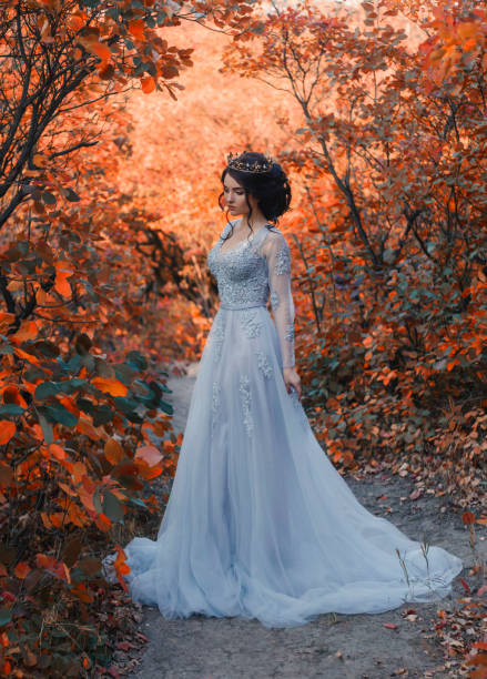 istock Beautiful brunette is walking in the autumn forest 865073734