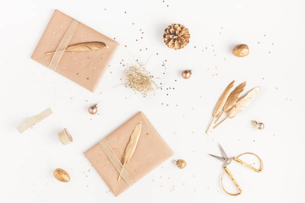 istock Christmas gifts, pine cone, golden decorations. Flat lay, top view 865074108