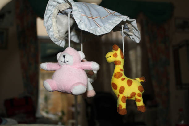 istock baby cot spining toys isolated 865087768