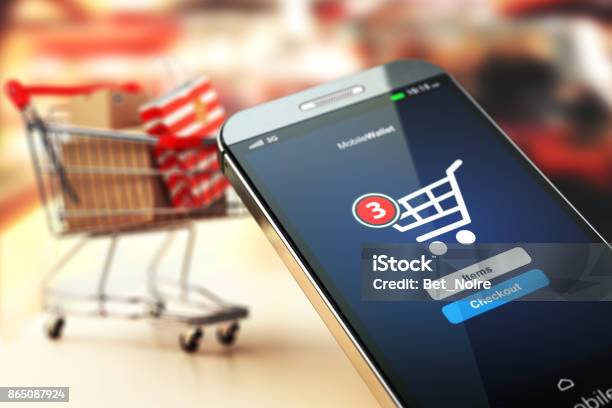 Online Shopping Concept Nackground Mobile Phone Or Smartphone With Cart And Boxes And Bag Stock Photo - Download Image Now