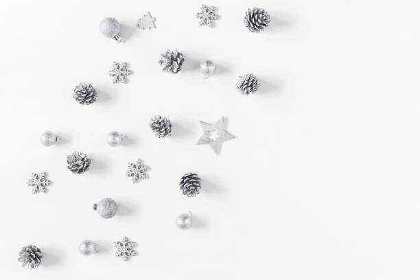 istock Christmas silver decorations on white background. Flat lay, top view 865091038
