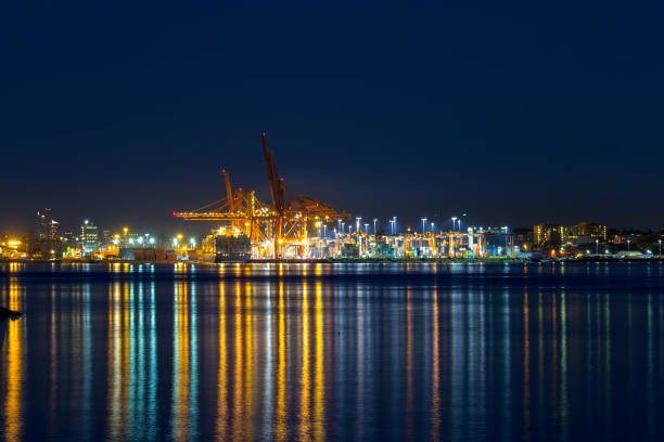 istock Port of Vancouver BC Canada container cargo shipyard blue hour 865097346