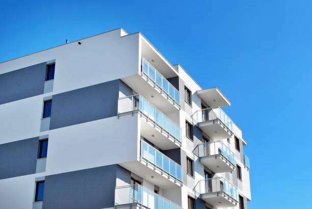 istock Modern, Luxury Apartment Building against blue sky 865100506
