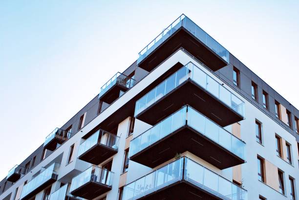 istock Modern, Luxury Apartment Building against blue sky 865101654