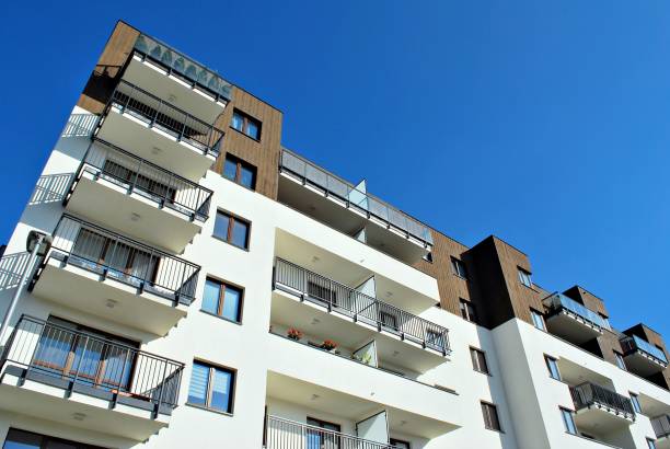 istock Modern, Luxury Apartment Building against blue sky 865102026