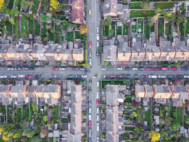 Old fashioned British suburb cross roads taken be an drone from the air.