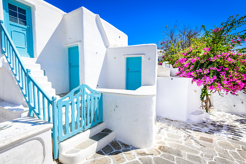 Mykonos, Greece. Whitewashed dotted alley in old city, Cyclades Greek Islands.