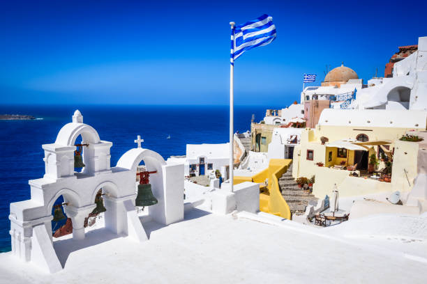 Santorini, Greece. Famous attraction of white Oia city, Greek Cyclades Islands, Aegean Sea.
