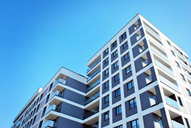istock Modern, Luxury Apartment Building against blue sky 865109076