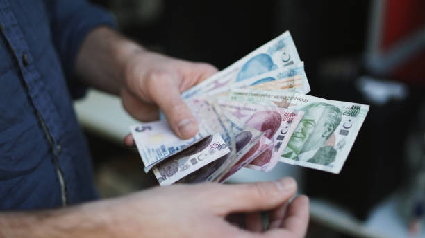 istock Man Holding Turkish Money Lira Currency 865109114