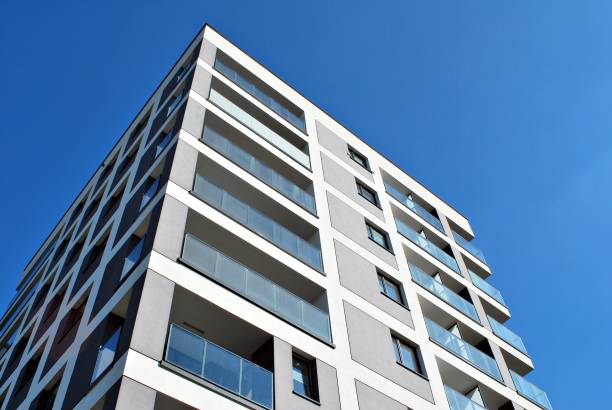 istock Modern, Luxury Apartment Building against blue sky 865110558