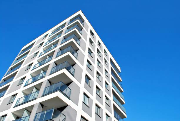 istock Modern, Luxury Apartment Building against blue sky 865112070