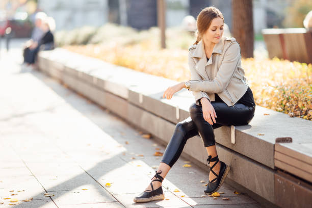 istock Pretty woman sit on the bench and smile 865126626