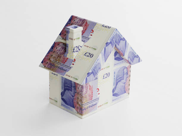 istock Tiny House Model Textured With 20 British Pound Banknotes On White Background 865126672