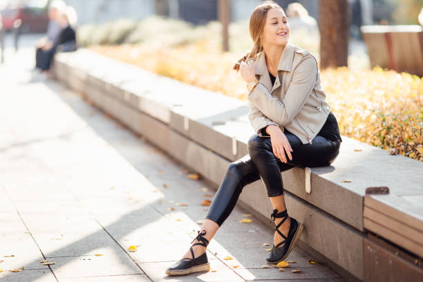 istock Pretty woman sit on the bench and smile 865126796