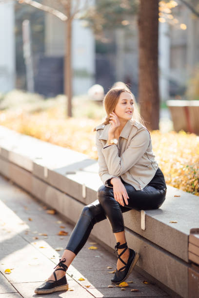 istock Pretty woman sit on the bench and smile 865126844
