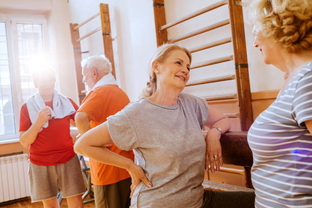 istock seniors gossiping after exercising together 865129900