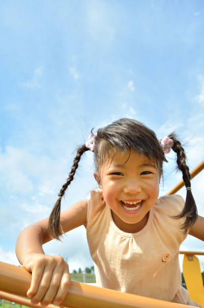 istock Girls playing in the park 865131260