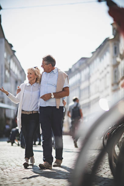 istock Senior Couples walking around the city 865135542