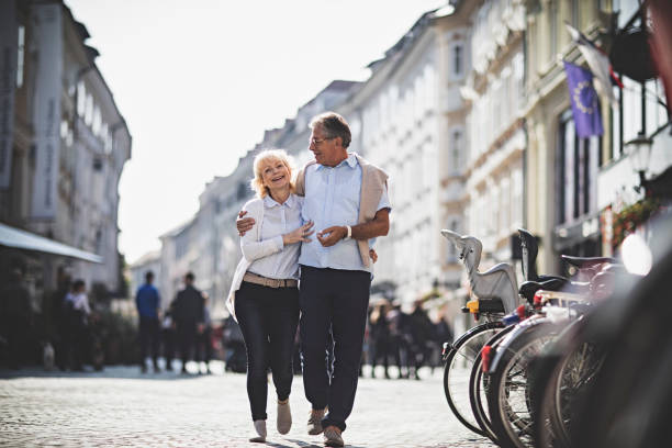 istock Senior Couples walking around the city 865136010