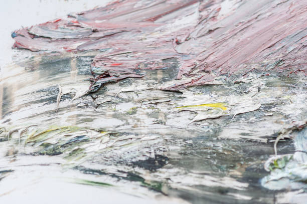 istock A close-up of a messy painted wall with bright paint clusters. 865139216
