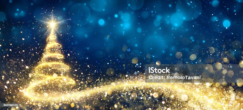 Golden Christmas Tree In Abstract Night Christmas Tree In Swirl - Glitter Flowing In Abstract Blue Christmas Stock Photo