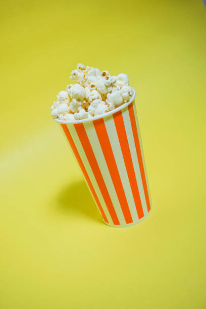istock The popcorn which was in the paper cup（Background yellow, Simple material） 865152794