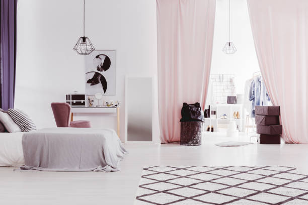 istock Pink curtains in sophisticated bedroom 865154398