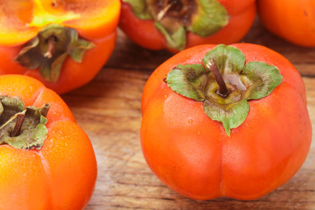 istock Fresh ripe persimmon with water drops. Selective focus 865154416