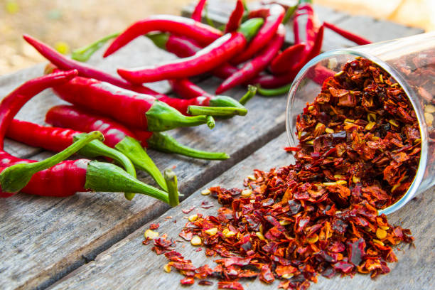 Red Pepper Flakes and red Chili Red chili peppers and flakes organic spice stock pictures, royalty-free photos & images