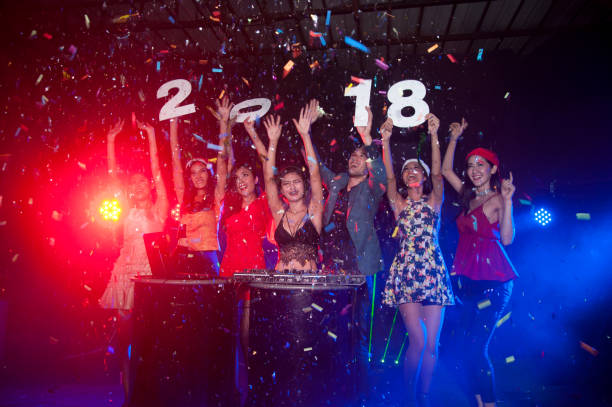 group of people dancing at night club with santa hat christmas holidays party. - political party concepts glamour friendship imagens e fotografias de stock
