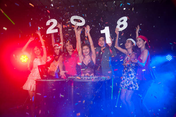 group of people dancing at night club with santa hat christmas holidays party. - political party concepts glamour friendship imagens e fotografias de stock