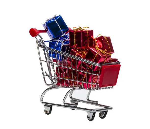 Shopping Cart with gift boxes isolated on white background